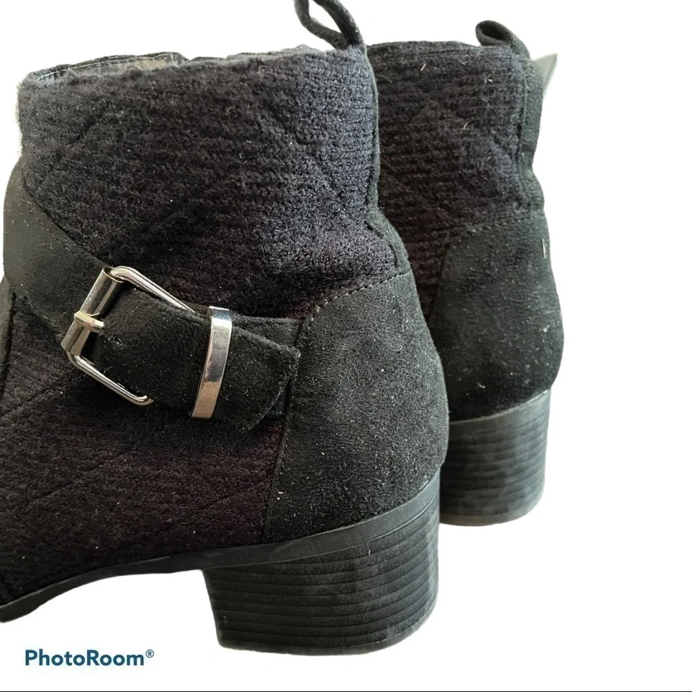 Women’s black ankle boots with buckle accents